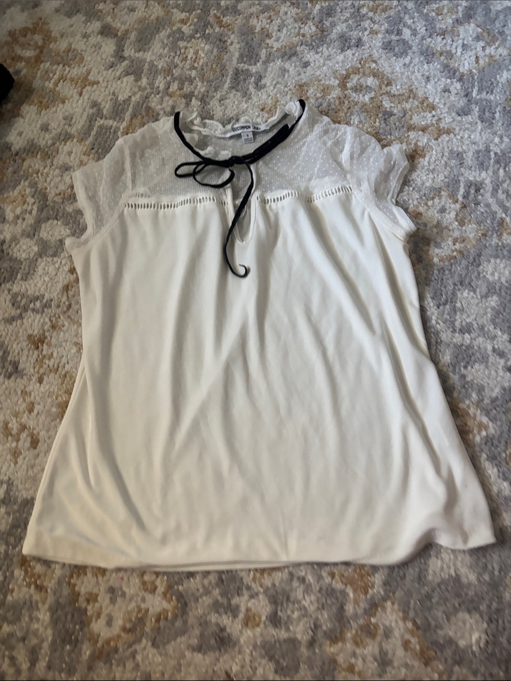 Charming White Tie-Neck Blouse with Black Trim